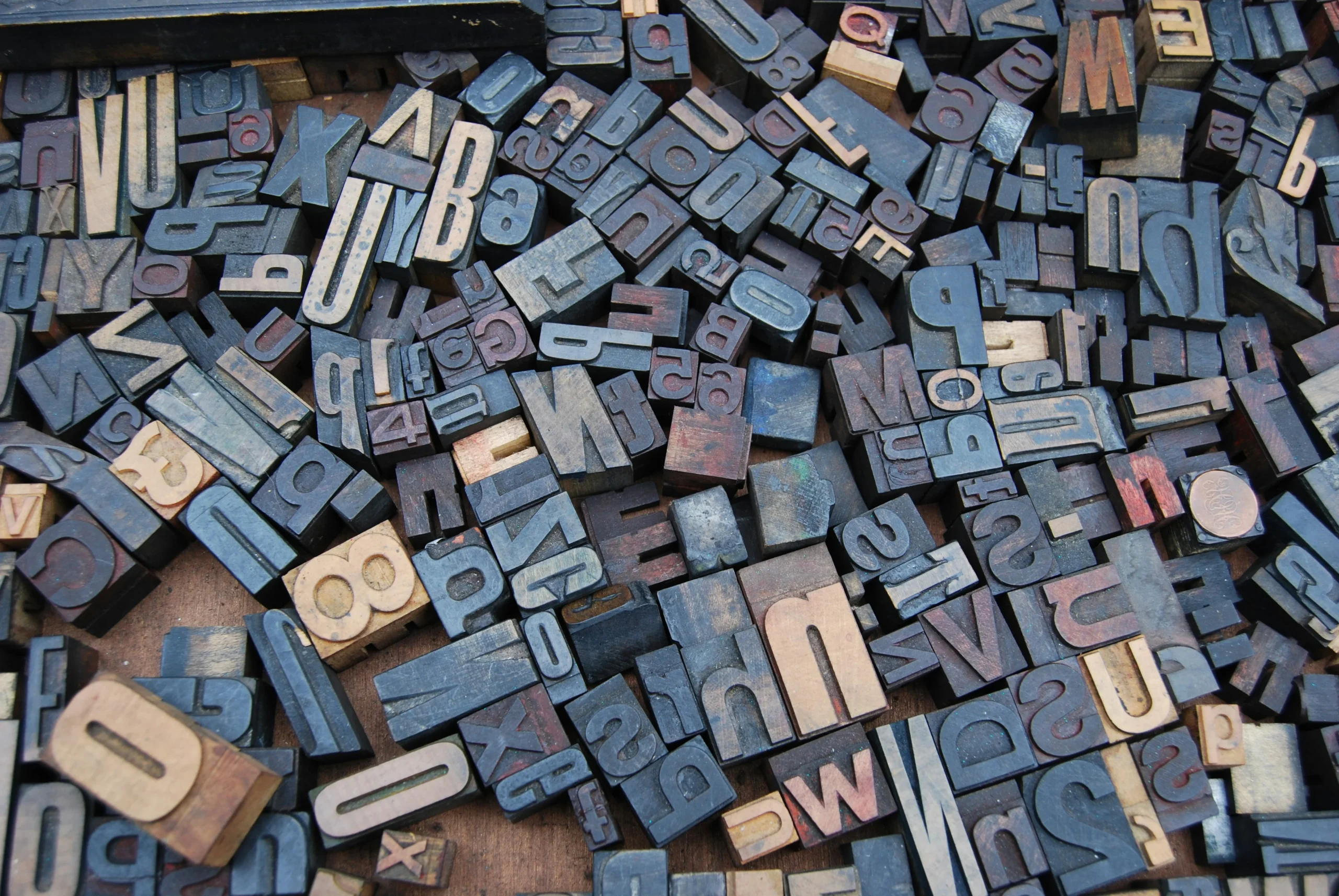 Many blocks of letter stamps in serif font.