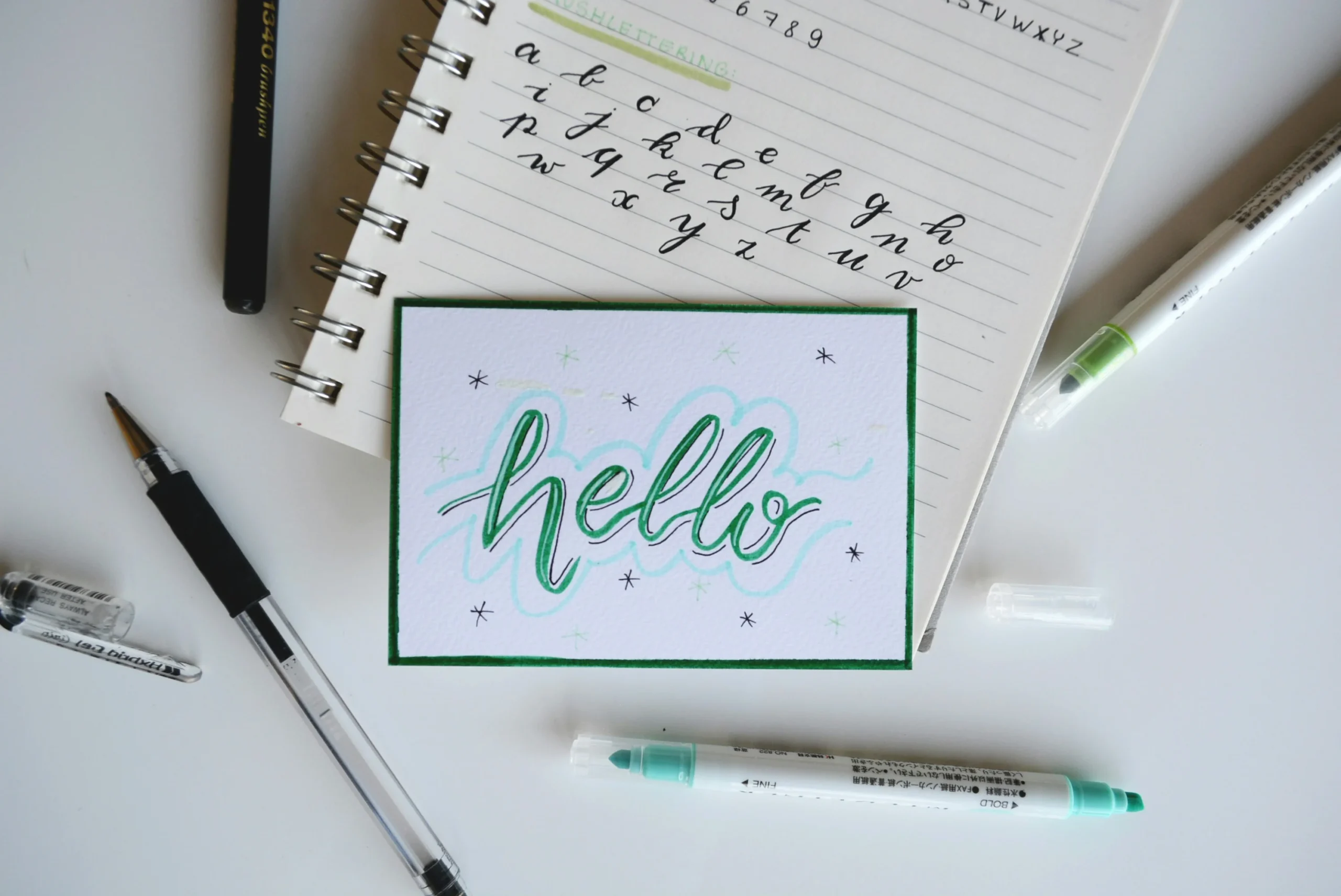 The word "hello" written in cursive on an ipad showing easy to read fonts.