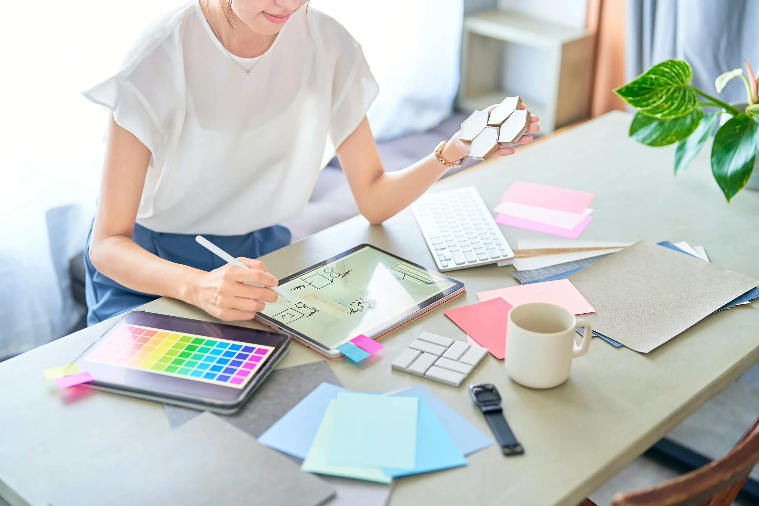 A woman looking over paint chips to help brands better use design elements.
