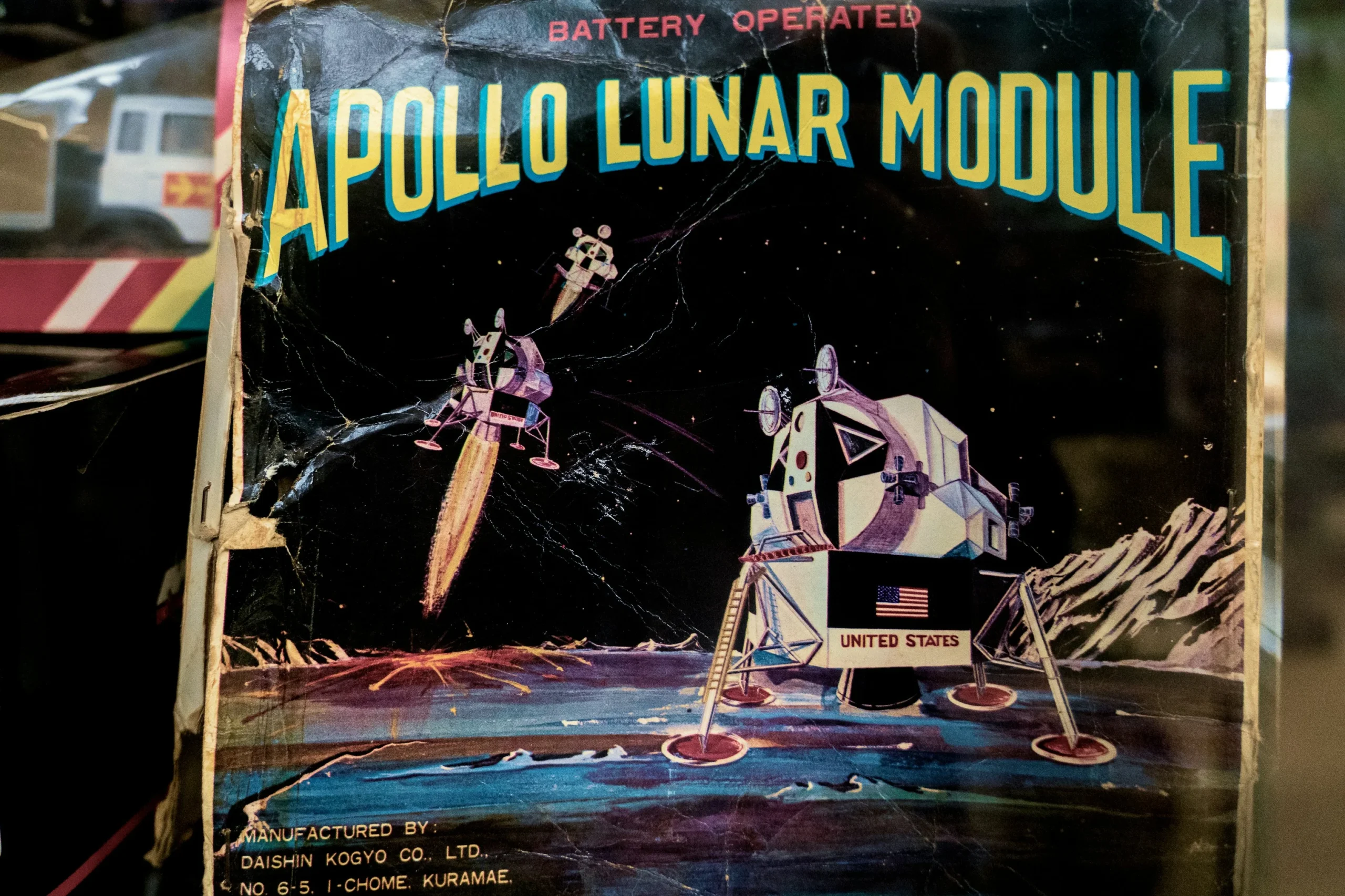 A retro themed illustration showing the apollo moon landing.