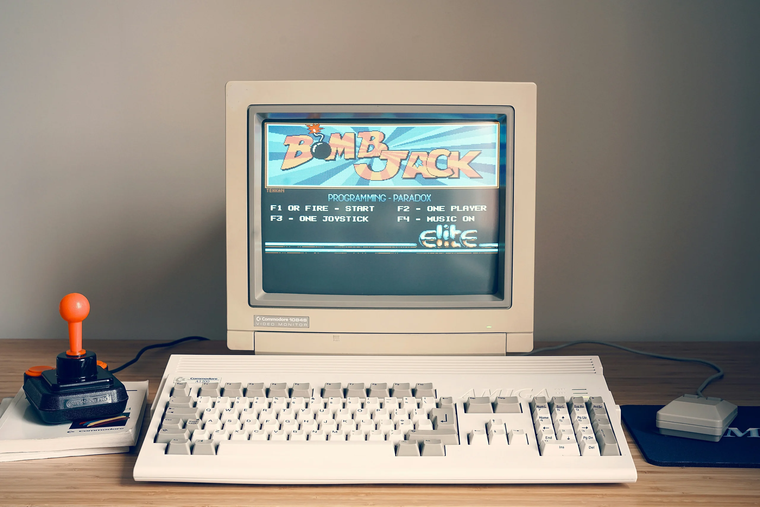 An old computer on a desk showing a retro website.