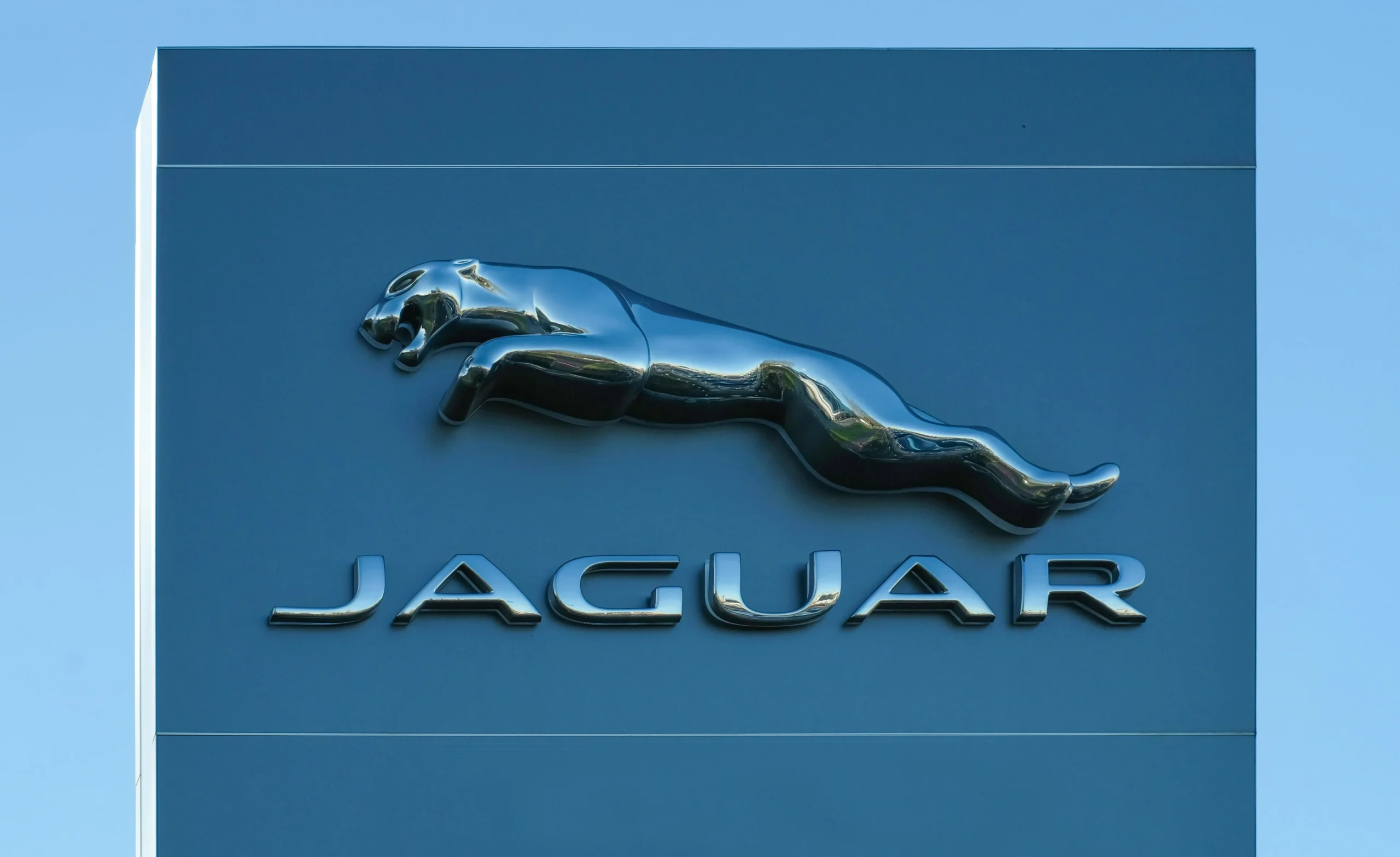 The Jaguar logo on a billboard.